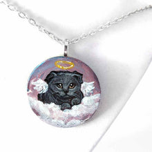 Load image into Gallery viewer, a small wood circle, hand painted with the portrait of a dark gray scottish fold cat, as an angel, with halo and wings, sitting on clouds against a pink and purple sky. available as a wood keepsake or pendant necklace
