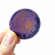 Load image into Gallery viewer, a small wood circle, hand painted with the portrait of a dark gray scottish fold cat, as an angel, with halo and wings, sitting on clouds against a pink and purple sky. available as a wood keepsake or pendant necklace, signed on the back with rainbowofcrazy
