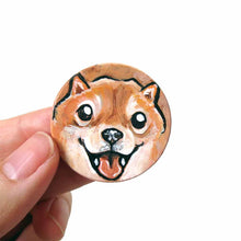 Load image into Gallery viewer, small wood disc painted with a smiling Shiba inu&#39;s face. available as a keepsake or pendant necklace 
