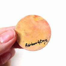 Load image into Gallery viewer, small wood disc painted with a smiling Shiba inu&#39;s face. available as a keepsake or pendant necklace, back signed with Rainbowofcrazy 
