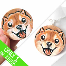 Load image into Gallery viewer, small wood disc painted with a smiling Shiba inu&#39;s face. available as a keepsake or pendant necklace 
