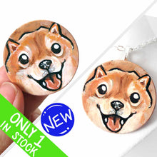 Load image into Gallery viewer, small wood disc painted with a smiling Shiba inu&#39;s face. available as a keepsake or pendant necklace 
