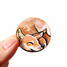 Load image into Gallery viewer, A circle wood disc painted with a portrait of a Shiba Inu dog having a nap, available as a keepsake, fridge magnet,
 or necklace
