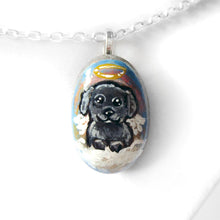 Load image into Gallery viewer, A small beach stone, hand painted with a portrait of a black shih tzu dog as an angel sitting in the clouds. Available as a keepsake or necklace
