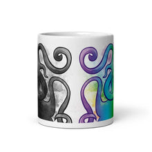 Load image into Gallery viewer, the Slender Man Love mug, 11 oz, showing the middle of the mug, showing the Slender Man graphic in black and white on the left side, and in rainbow colours on the right side.
