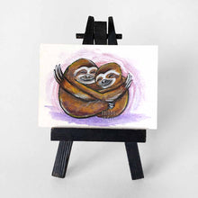 Load image into Gallery viewer, An ACEO sized painting of two sloths hugging each other
