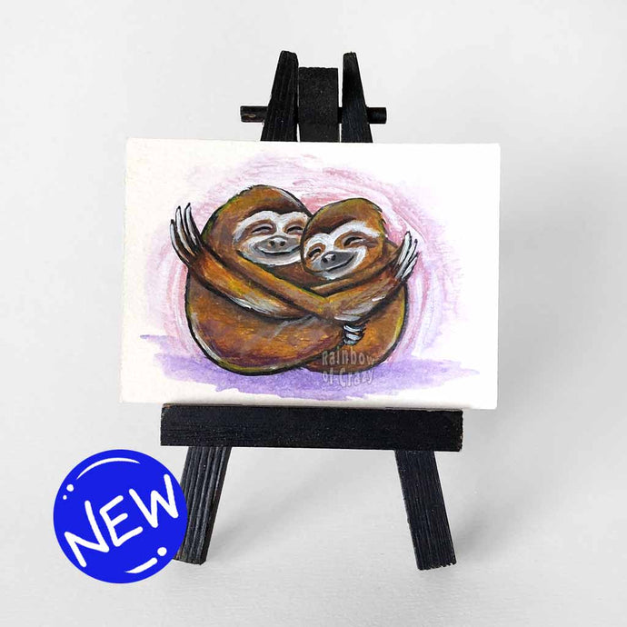 An ACEO sized painting of two sloths hugging each other
