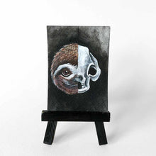 Load image into Gallery viewer, ACEO painting split into two halves: one side featuring a sloth’s smiling face, the other, an eerie sloth skull.
