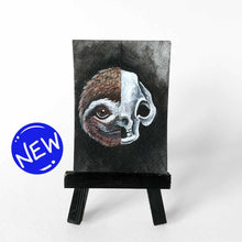 Load image into Gallery viewer, ACEO painting split into two halves: one side featuring a sloth’s smiling face, the other, an eerie sloth skull.
