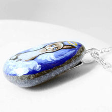 Load image into Gallery viewer, a small beach stone hand painted with the portrait of a snowshoe cat, as an angel on the clouds. available as a keepsake or pendant necklace
