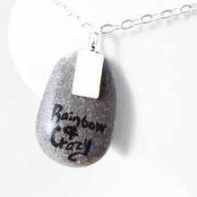 Load image into Gallery viewer, a small beach stone hand painted with the portrait of a snowshoe cat, as an angel on the clouds. available as a keepsake or pendant necklace. back signed with Rainbowofcrazy
