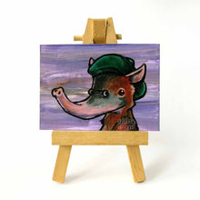 Load image into Gallery viewer, aceo sized painting of a solenodon wearing a green beret and tiny sunglasses agains ta soft purple background. painting sits on a tiny wood easel
