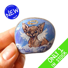 Load image into Gallery viewer, a beach stone, hand painted with a portrait of a sphynx cat, painted as an angel with halo and wings, sitting on fluffy clouds
