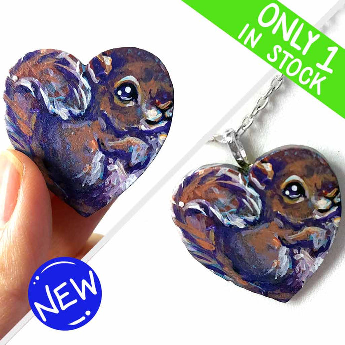 a lightweight wood heart, hand painted with a portrait of a squirrel, available as a keepsake or pendant necklace