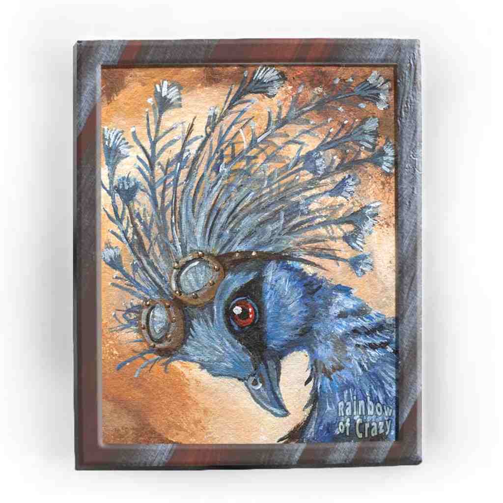 An art print with a portrait of a Victora Crowned Pigeon with steampunk goggles on its head