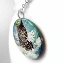 Load image into Gallery viewer, a small wood disc, hand painted with the portrait of a gray tabby cat, as an angel with wings and halo, sitting on clouds against a blue sky. this painting is available as a keepsake or pendant necklace
