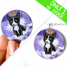 Load image into Gallery viewer, a portrait of a tuxedo cat as an angel, sitting on clouds against a purple sky, painted on a small wood disc, available as a keepsake or pendant necklace
