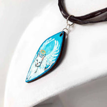 Load image into Gallery viewer, diamond shaped wood pendant necklace, hand painted with a smiling white cat as an angel, eyes closed, with a halo and wings, lying on clouds against a blue sky
