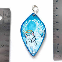 Load image into Gallery viewer, diamond shaped wood pendant necklace, hand painted with a smiling white cat as an angel, eyes closed, with a halo and wings, lying on clouds against a blue sky
