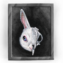 Load image into Gallery viewer, an art print featuring an illustration of a white rabbit&#39;s face. the image is split into two sides: the right side revealing the rabbit&#39;s skull.
