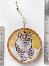 Load image into Gallery viewer, A wooden ornament with a painting of an American Curl cat with golden eyes, next to two rulers to show its size: 3 1/4 x 3 1/4 inches or 8.3 x 8.3 cm across
