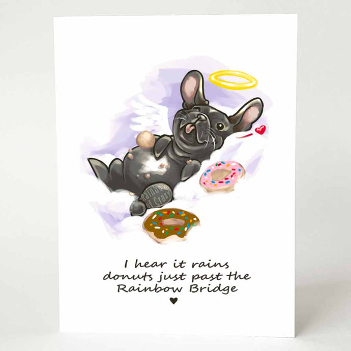 A greeting card with an illustration of a French bulldog angel, lying down with donuts, with the text, 