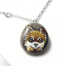 Load image into Gallery viewer, a pendant necklace handmade from a beach rock, hand painted with a dog portrait of a brown and white chihuahua
