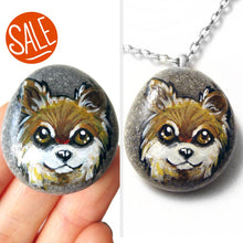 Load image into Gallery viewer, a beach stone, wtih dog art: a painting of a brown and white long haired chihuahua, available as either a stone keepsake or a pendant necklace
