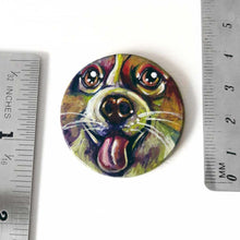 Load image into Gallery viewer, A circle wood disc with a portrait of a corgi, hand painted in rainbow colours, next to two rulers to show its size: 1 1/2&quot; or 3.8 cm across
