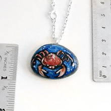 Load image into Gallery viewer, the cancer crab necklace, next to two rulers to show its size: 1 3/8&quot; x 1&quot; - or - 3.5 cm x 2.6 cm
