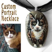 Load image into Gallery viewer, A personalized pet necklace, made from a beach stone, includes a portrait painting of a snowshoe cat
