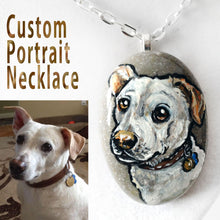 Load image into Gallery viewer, A beach stone is hand painted and crafted into a necklace, customized with a portrait of a white dog
