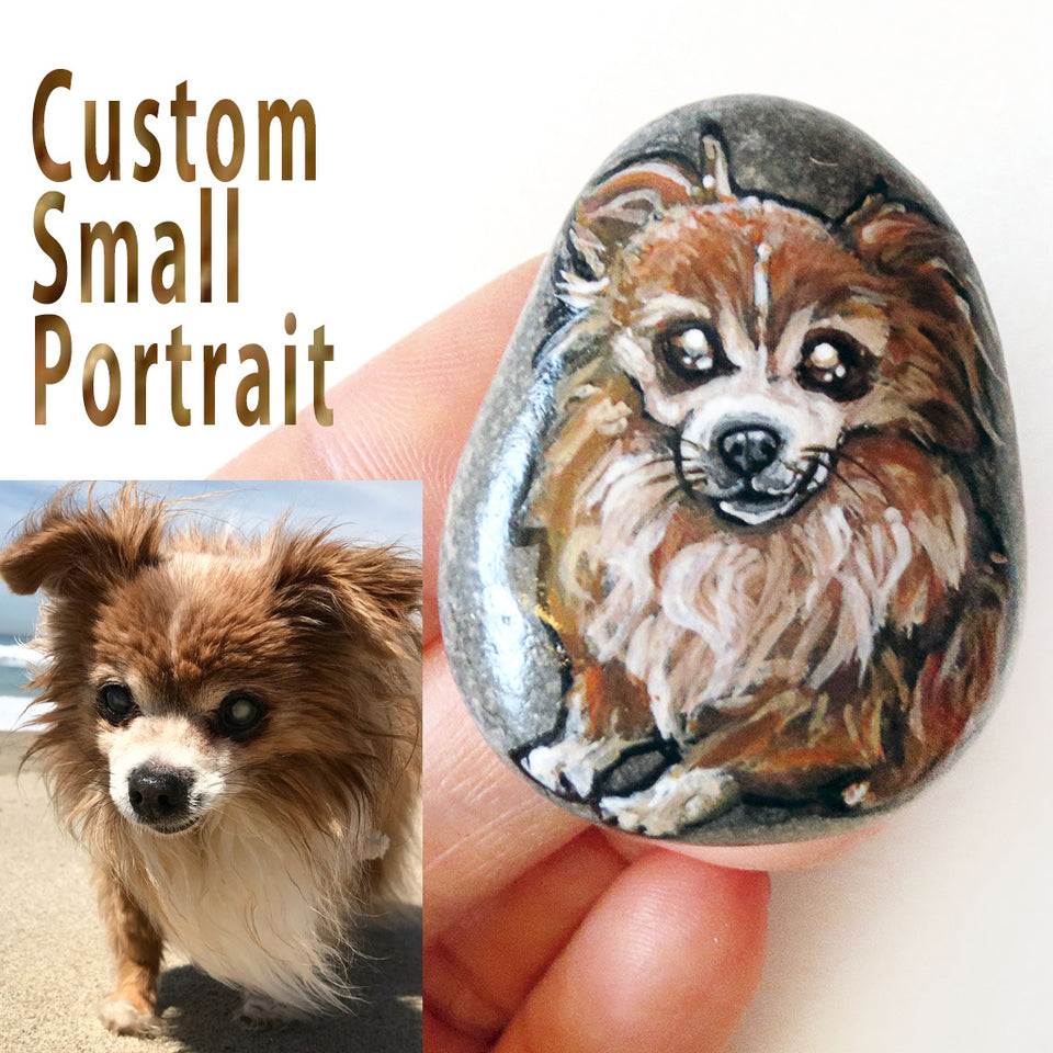 a small beach rock with a custom portrait of a brown and white long haired chihuahua dog