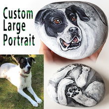 Load image into Gallery viewer, A custom pet portrait painting, on a large stone, of a black and white dog,
