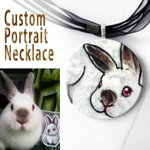 Load image into Gallery viewer, A custom pet portrait painting, on a circle wood necklace, of a brown and white bunny rabbit with red eyes.
