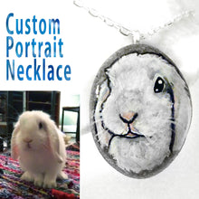 Load image into Gallery viewer, A customized pet portrait necklace, painted on a beach rock, of a close-up of a white rabbit
