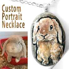 Load image into Gallery viewer, A custom pet portrait necklace, painted on a beach rock, of a tan coloured mini lop rabbit.
