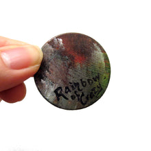 Load image into Gallery viewer, The back of a dacshund wood pendant, signed with &quot;Rainbow of Crazy&quot;
