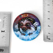 Load image into Gallery viewer, a wooden disc, with a hedgehog angel painting, next to two rulers to show its size (1 1/2 inches or 3.8 cm across)
