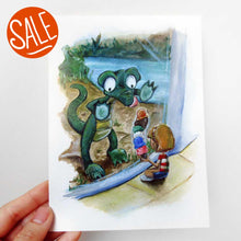 Load image into Gallery viewer, A hand holds up a 5x7 art print of an illustration: a crocodile up against the glass at the zoo, staring at the ice cream that a little girl is holding.
