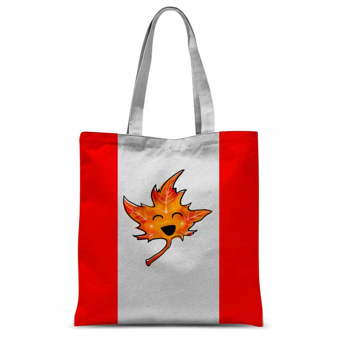 A white tote bag printed with the Canadian flag, but with a stylized, smiling maple leaf, with its eyes closed