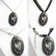 Load image into Gallery viewer, A collage, showing a cat portrait pendant, with the left side showing the necklace on a chain, and on the right side, the pendant hanging from a black cord ribbon necklace.A collage, showing a cat portrait pendant, with the left side showing the necklace on a chain, and on the right side, the pendant hanging from a black cord ribbon necklace.
