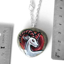 Load image into Gallery viewer, the aries / ram necklace, next to two rulers to show its size: 1 3/8&quot; x 1 3/8&quot; or 3.5 cm x 3.5 cm
