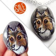 Load image into Gallery viewer, a beach rock painted with dog art: a portrait of a rough collie, available as either a keepsake or a pendant necklace
