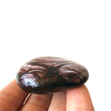 Load image into Gallery viewer, the bottom side of wade the walrus painting on a beach rock
