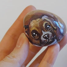 Load and play video in Gallery viewer, a small beach stone hand painted with a boxer dog
