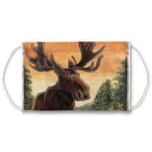 Load image into Gallery viewer, A white reusable face mask features art of a moose in a forest, in front of an orange sky. 
