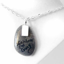 Load image into Gallery viewer, a small beach stone, hand painted with a little black cat, with a red balloon, sitting on clouds against a blue sky. available as a keepsake or pendant necklace, back signed with, Rainbow of Crazy
