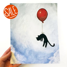 Load image into Gallery viewer, an art print with an illustration of a silhouette of a black cat, attached by the waiste to a big red balloon, as it floats through a blue cloudy sky
