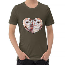 Load image into Gallery viewer, A man wearing the Barn Owl Love Premium Unisex T-Shirt in army brown, includes art of two barn owls forming the shape of a heart.
